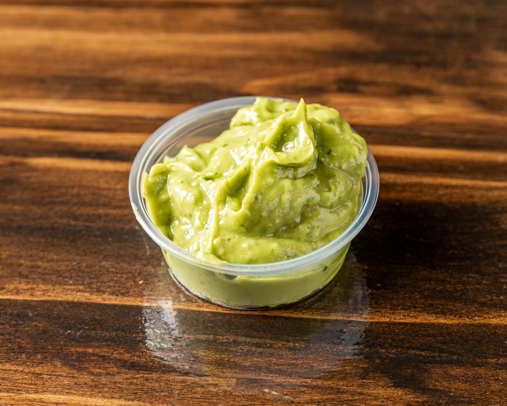 Hand-made guacamole with ripe avocado, lime and cilantro